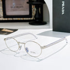 Prada eyeglasses with round silver frames and blue-tinted lenses