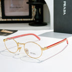Prada eyeglasses with round gold frames and red striped temples