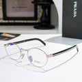 Prada eyeglasses with round gold metal frames and blue-tinted lenses