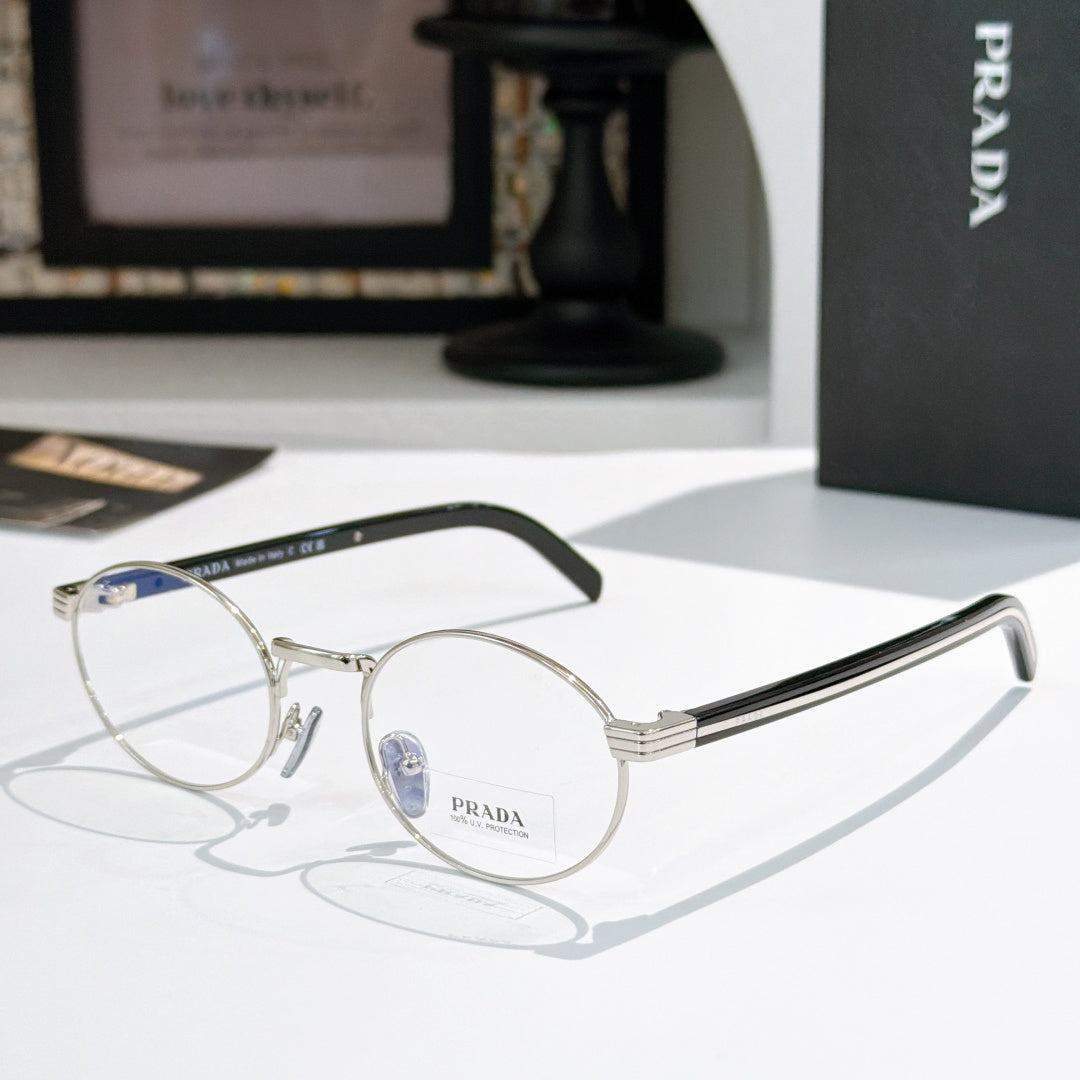 Prada eyeglasses with round gold metal frames and blue-tinted lenses