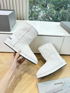 Balenciaga ladies luxury ankle boots, light white suede pull-on, shown from side