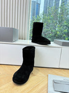 Black suede ankle boots, low heel, textured finish, side logo lettering