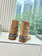 Tan suede ankle boots with BALENCIAGA logo on heel collar