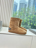 Tan suede ankle boots with stitched seam and BALENCIAGA logo patch