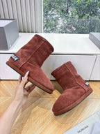Women’s reddish-brown suede ankle boots, two pairs shown with Balenciaga logo patch
