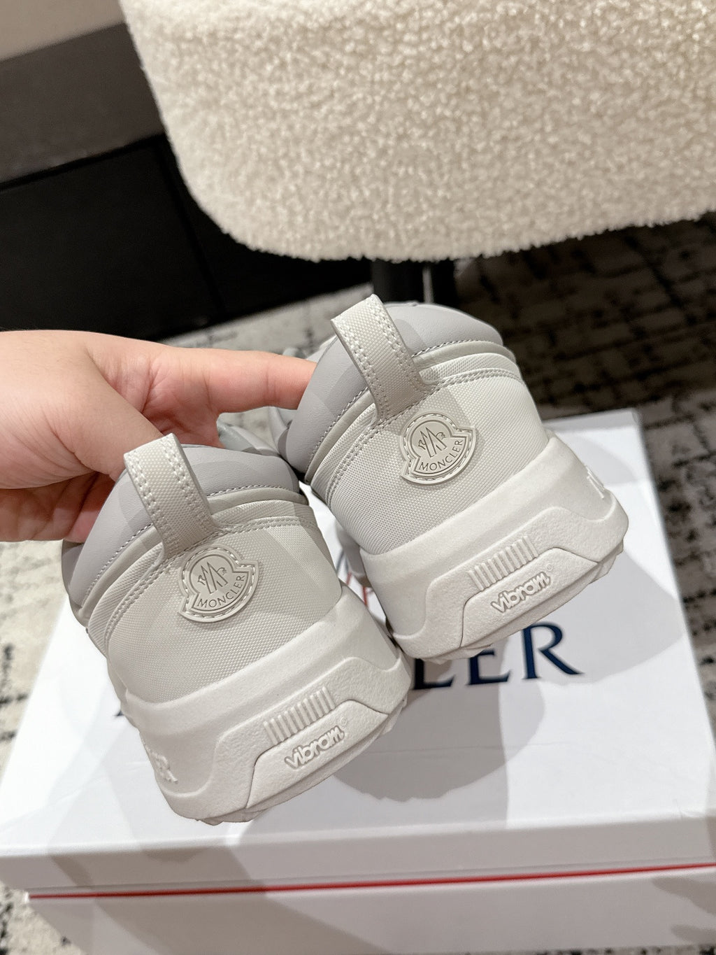 White sneaker heels, back logo patch and molded rubber sole