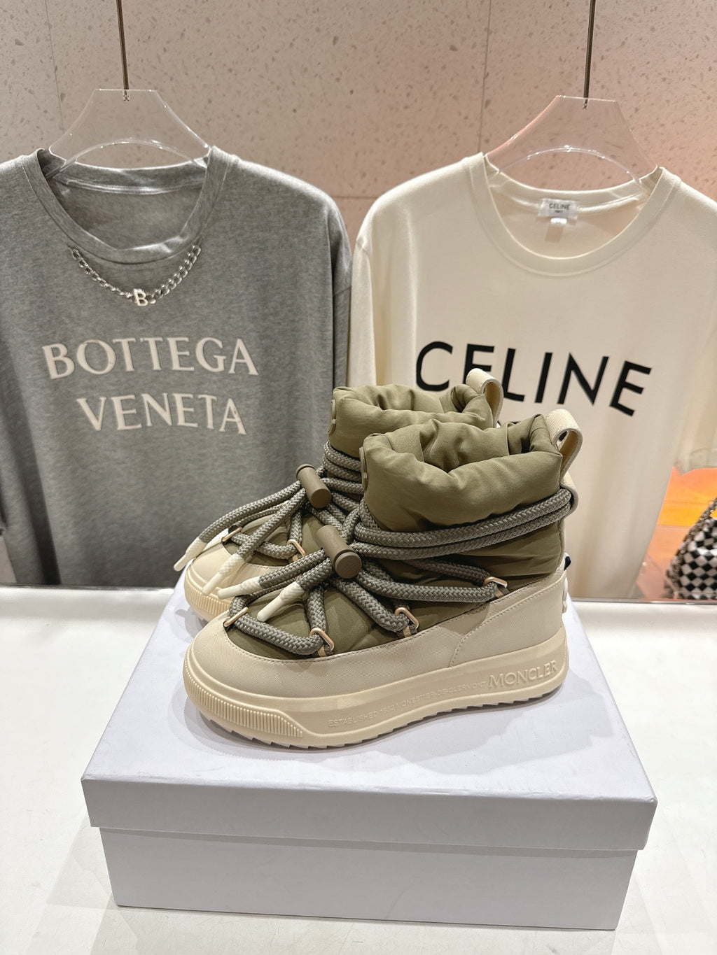 Moncler sneaker close-up, beige leather, olive lace-up detail, cushioned collar