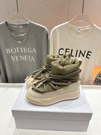 Moncler sneaker close-up, beige leather, olive lace-up detail, cushioned collar