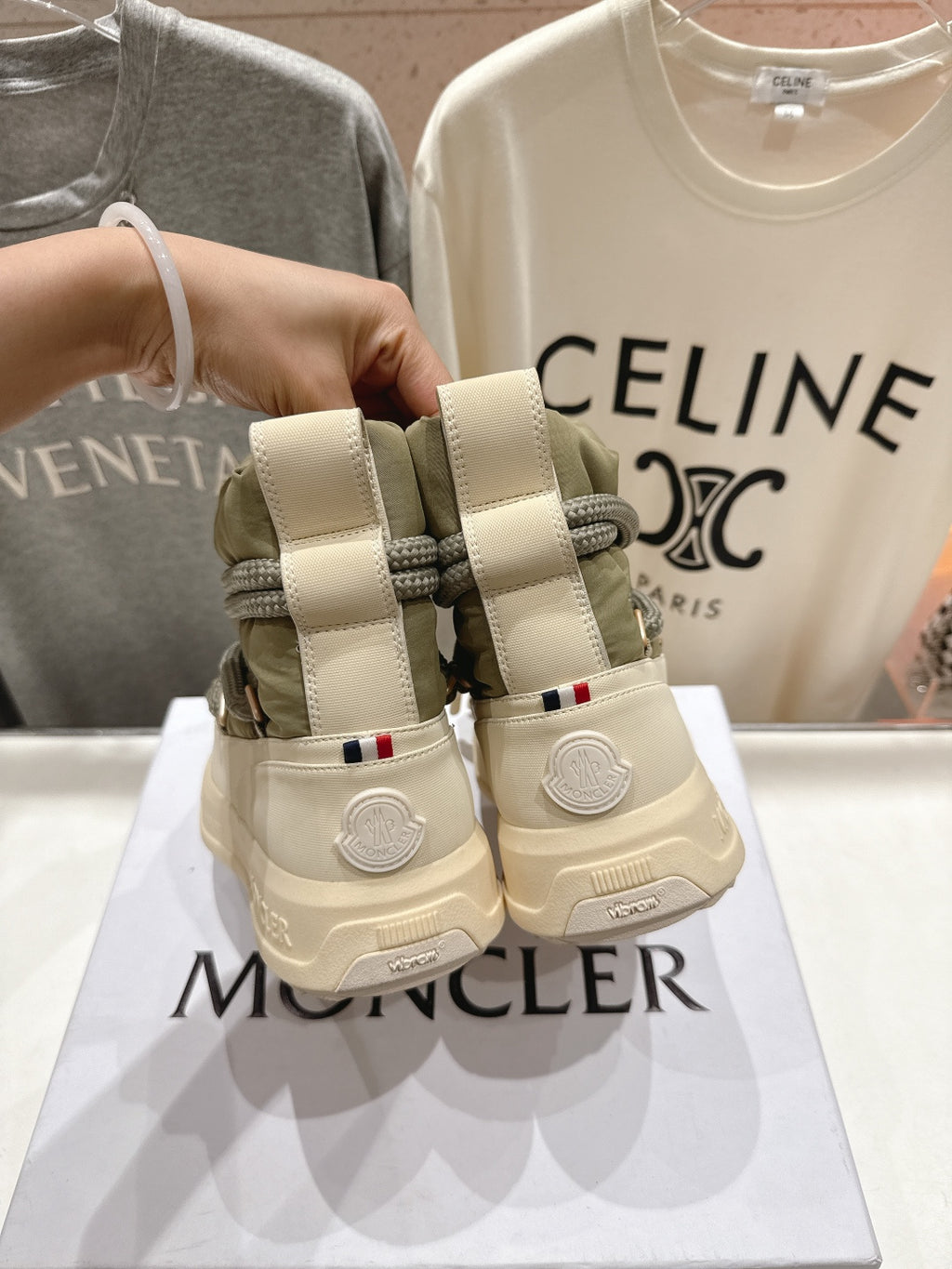 Moncler sneakers from back, beige uppers with olive laces and heel loop straps