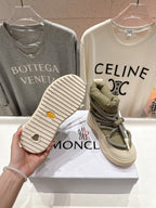 Moncler sneaker outsole view, beige tread sole with small round logo detail