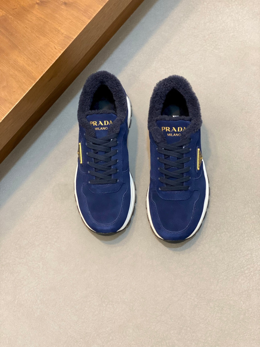 Prada unisex suede sneakers in dark blue, lace-up with gold triangle logo