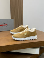 Prada unisex tan suede sneakers with white laces, shearling trim, and chunky sole