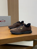 Prada lace-up sneakers in brown suede with black faux-fur lining and green logo patch