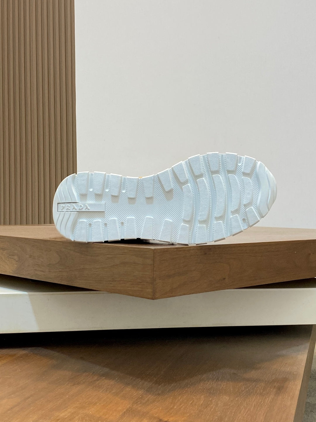 Prada unisex sneaker outsole view with white rubber tread sole