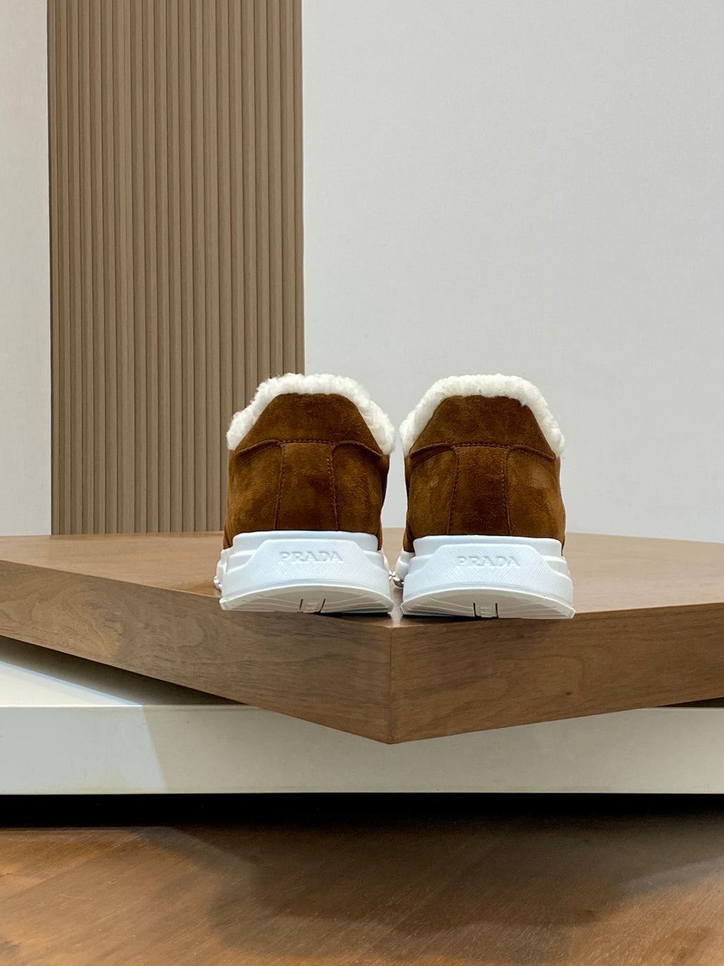 Brown suede sneakers with shearling lining and white heel tabs, Prada