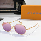 Round sunglasses with gold frame and purple gradient lenses, rhinestone detail at lens