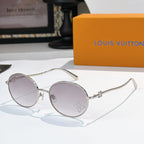 Round sunglasses with silver frame and lavender gradient lenses, rhinestone detail at lens