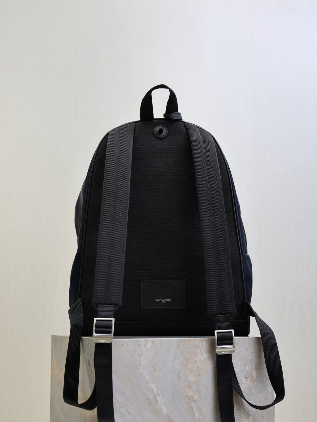 YSL black backpack with adjustable shoulder straps and small front label