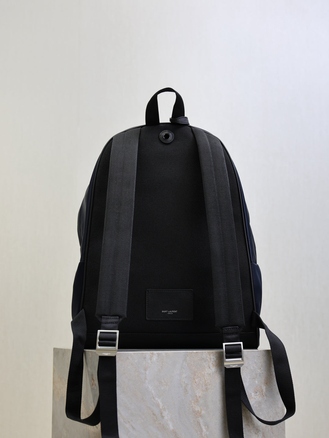 YSL black backpack with adjustable shoulder straps and small front label