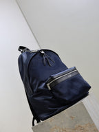 YSL navy backpack with front zip pockets and top carry handle