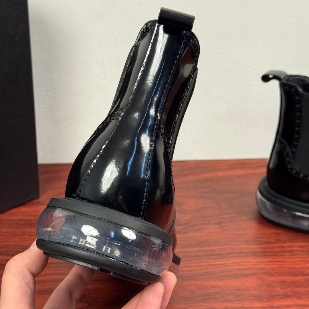 Prada chelsea boot heel view, glossy black leather with elastic gore and rubber sole