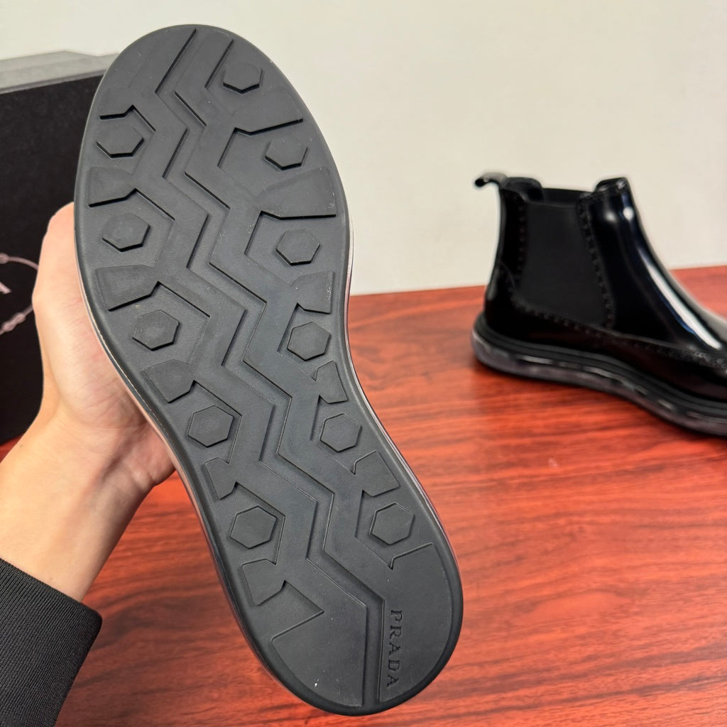 Prada chelsea boot outsole, gray tread with PRADA text on the heel area