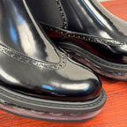 Prada chelsea boot toe detail, glossy black leather with stitched brogue-like trim