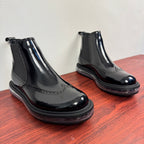 Prada chelsea boots pair, glossy black leather with elastic gore and thick rubber sole