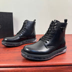 Black leather lace-up ankle boots, side view pair with stitched panel details.