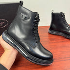 Black leather lace-up ankle boot with Prada logo badge and metal eyelets.