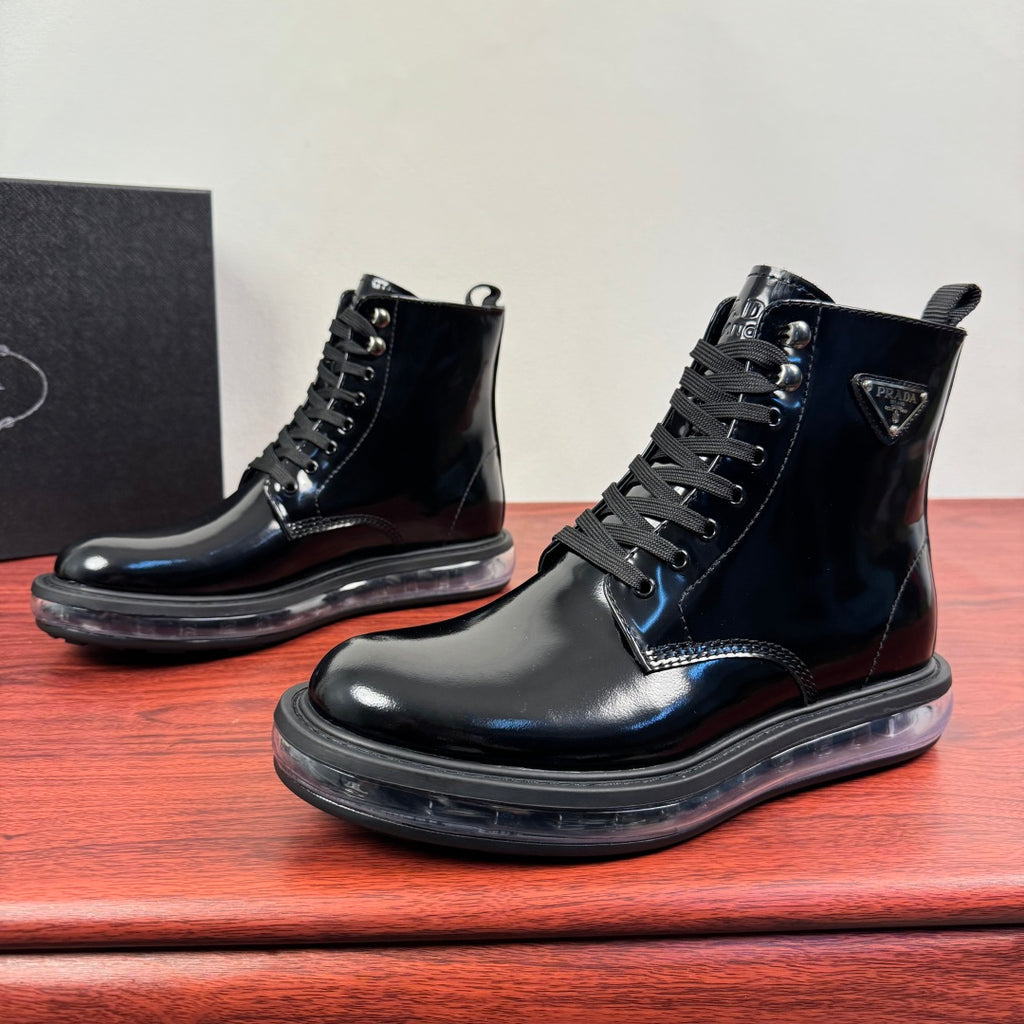 Black lace-up ankle boots with side logo patch and thick tread sole