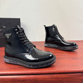 Black lace-up ankle boots with side badge and chunky rubber sole