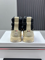Moncler sneakers from back view, black and cream high-top lace design
