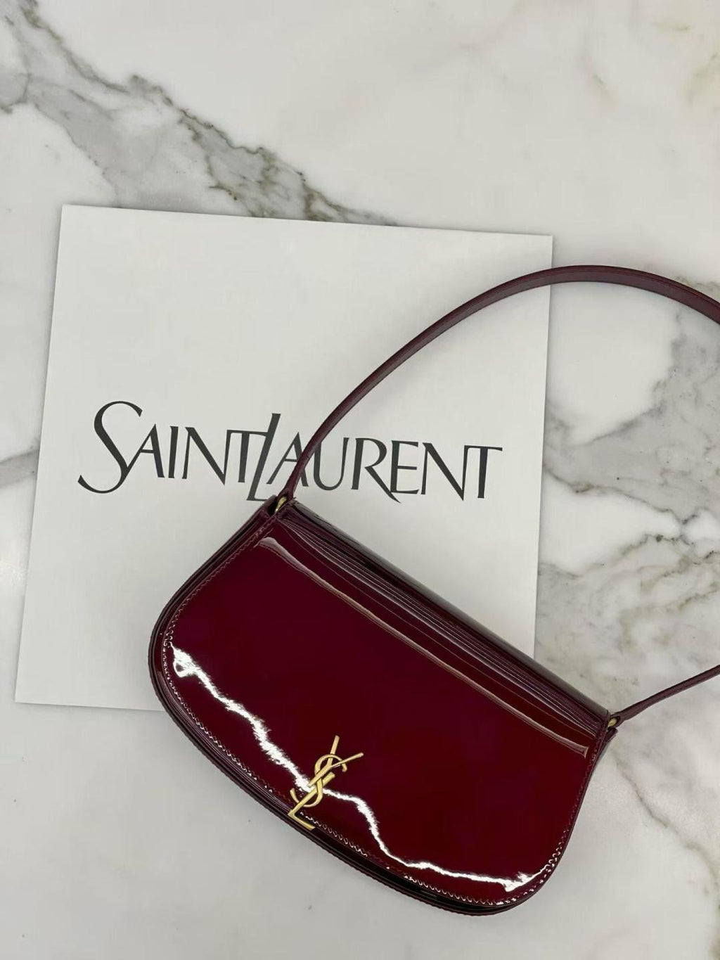 YSL small burgundy glossy shoulder bag with gold-tone YSL logo