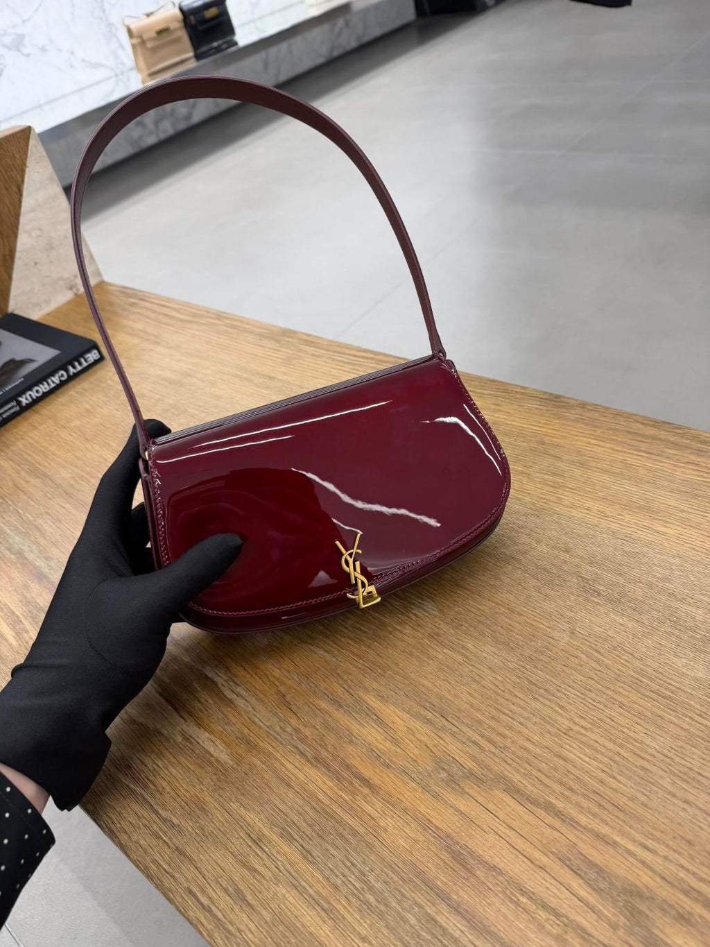 YSL burgundy glossy mini shoulder bag with gold-tone YSL logo
