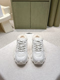 White unisex sneakers with lace-up front and fuzzy shearling collar detail