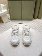White unisex sneakers with lace-up front and fuzzy shearling collar detail