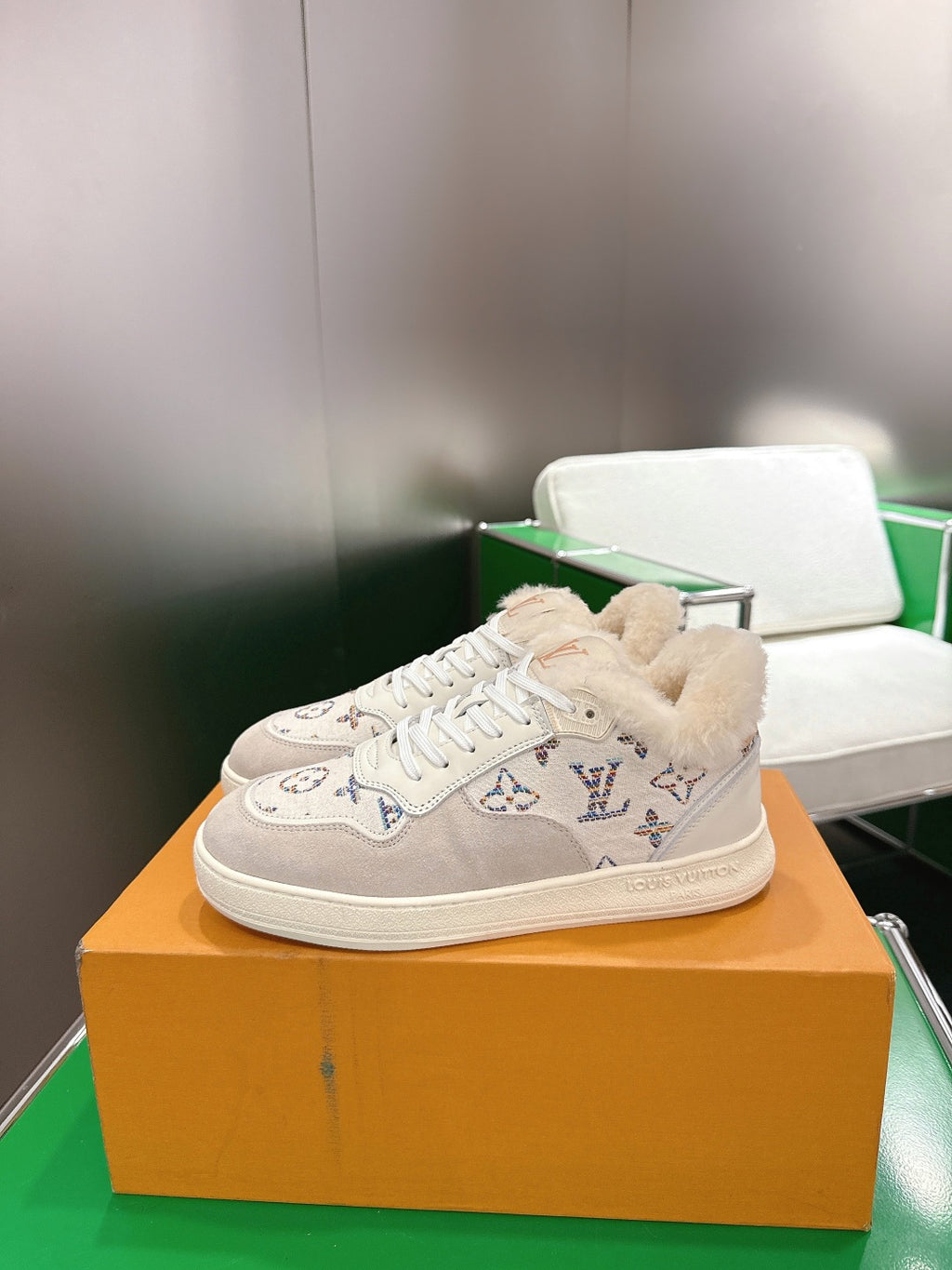 White Louis Vuitton high-top sneakers with shearling trim and monogram pattern