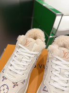 White Louis Vuitton high-top sneakers with shearling tongue and lace-up front