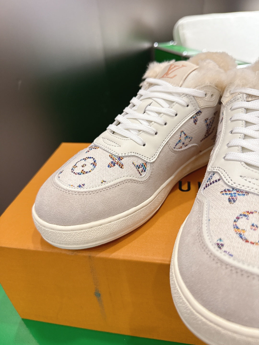 White Louis Vuitton high-top sneakers with monogram embroidery and white laces