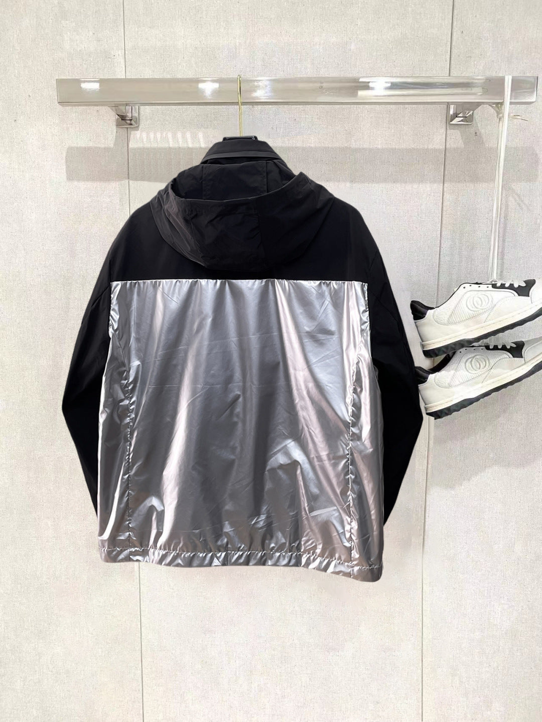 Moncler long hooded jacket, back view with silver center panel and black trim