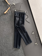 Dark straight-leg pants with elastic waistband, drawstring, side pocket with cross stitch