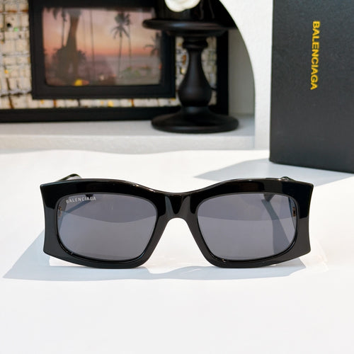 Black square sunglasses with dark lenses and gold BB logo at temples