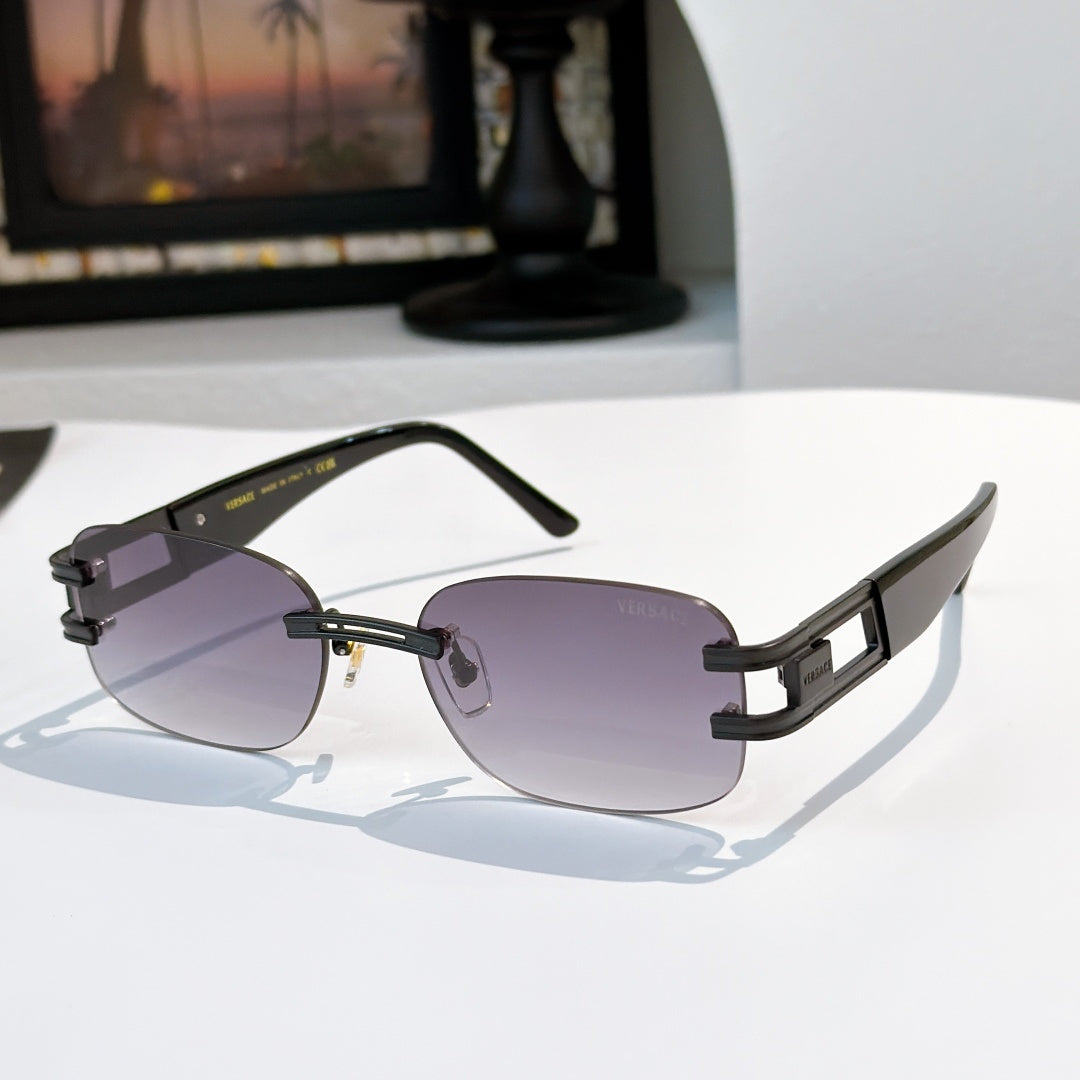Sunglasses with purple-gray lenses and black frame, gold geometric temple hardware