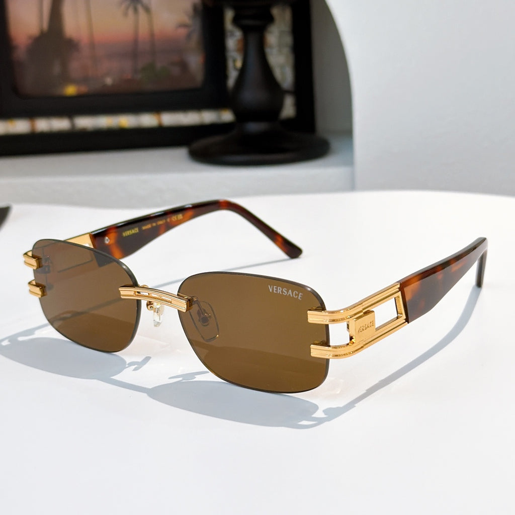 Sunglasses with brown lenses and gold frame, tortoiseshell temple accents