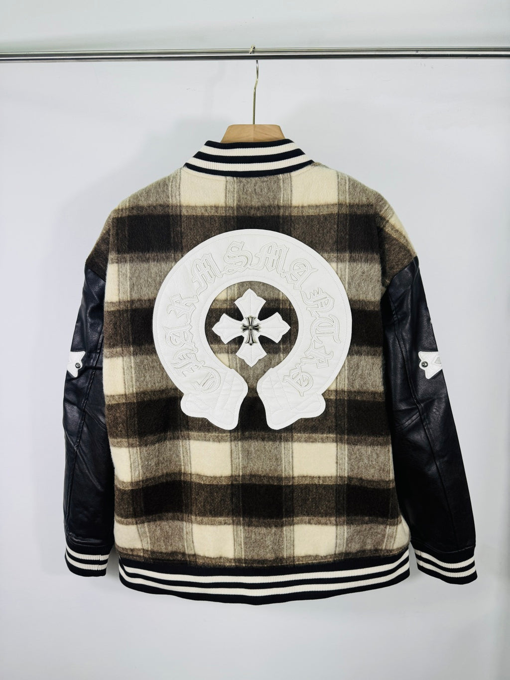 Plaid varsity jacket back view with large crest patch and ribbed striped collar
