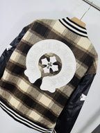 Plaid varsity jacket back with oversized crest patch and black faux-leather side panels