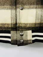 Plaid varsity jacket front hem with snap buttons and ribbed striped cuffs