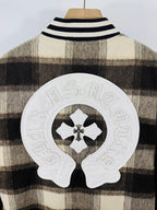 Large white cross-head patch on plaid jacket back with black emblem in center