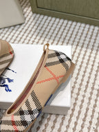 Burberry check ballet flats close-up, tan trim and rounded instep opening
